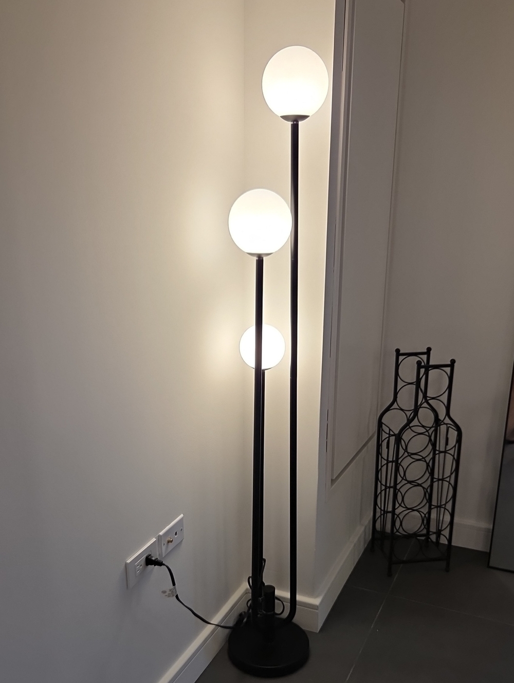Black Triple-Globe Floor Lamp with White Glass Shades